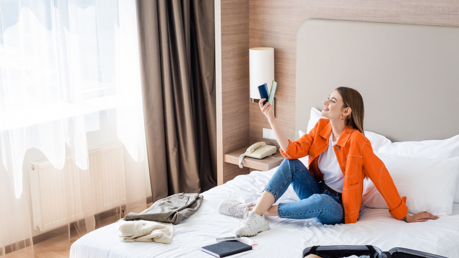 A photo of a traveler checking into a charming boutique hotel with friendly staff and cozy atmosphere.