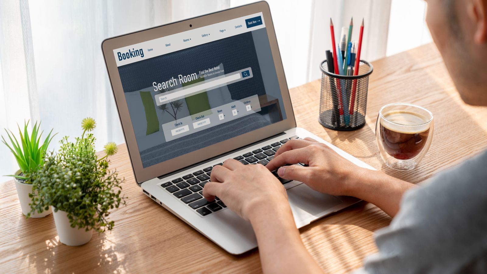 A photo of a man facing laptop