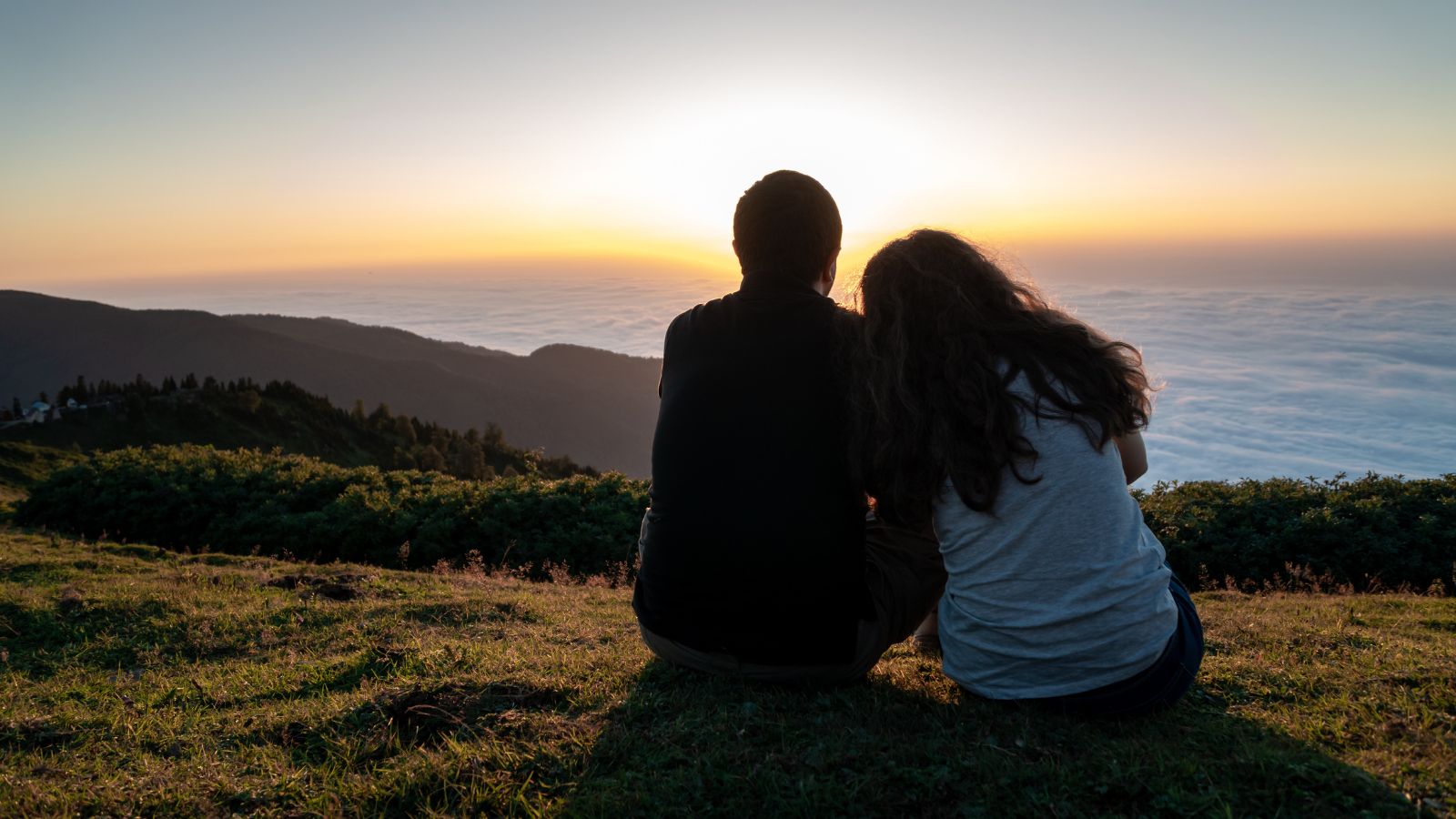 A photo of couple walking through a charming historic European street, exploring and enjoying the surroundings together.
