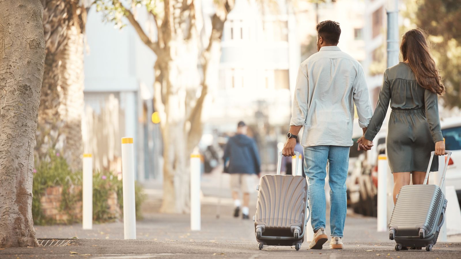A photo of couple walking together through a beautiful city street at sunset, relaxed and enjoying their trip.