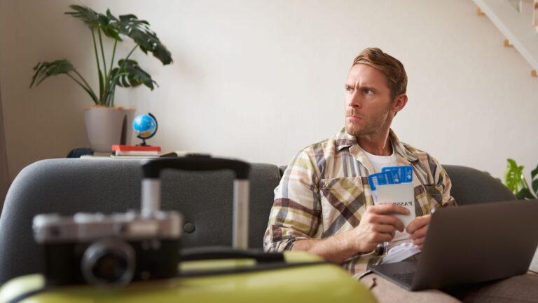 A photo of a man that shows an unsatisfied emotion.