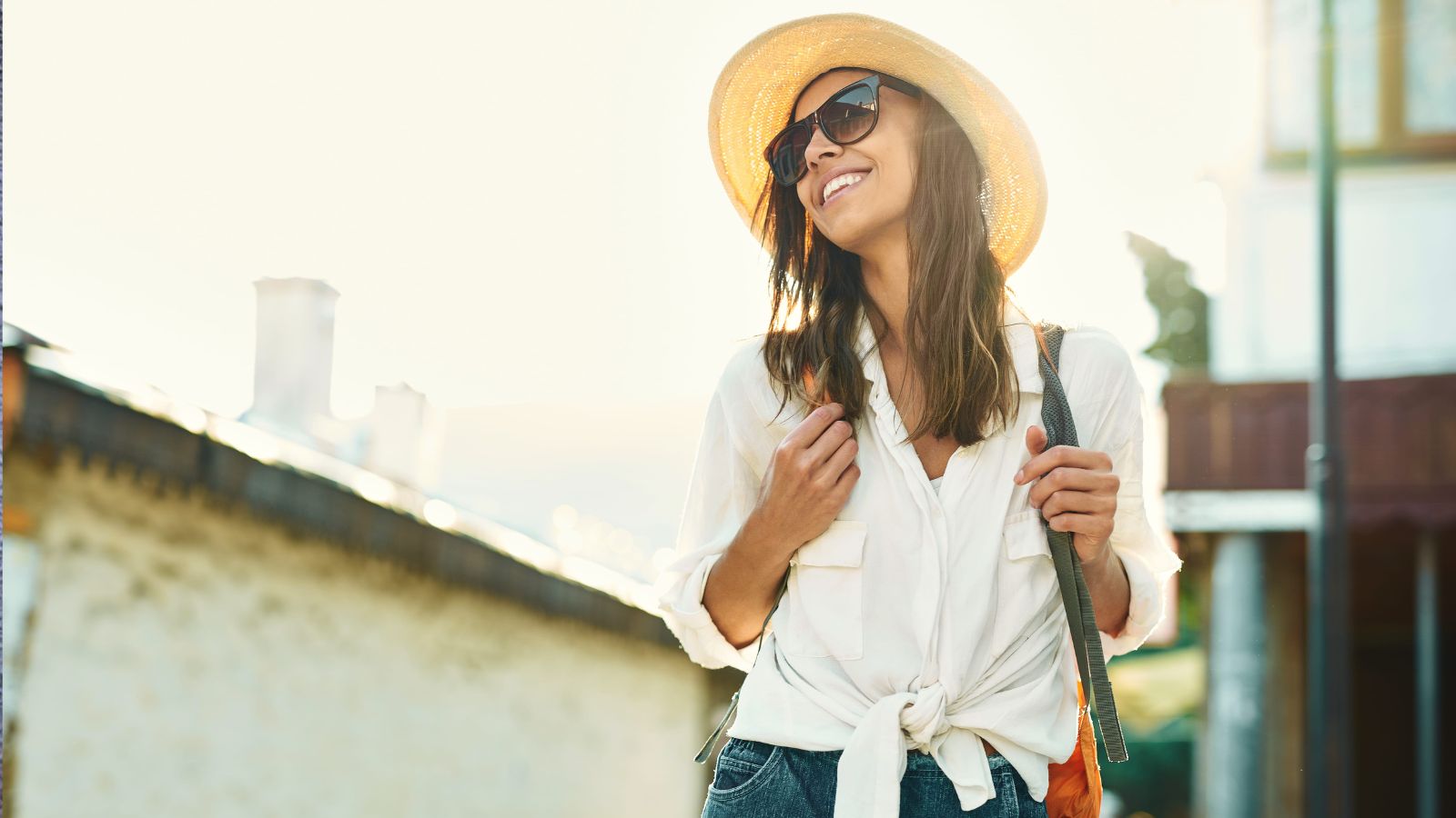 A photo of a traveler strolling slowly through a scenic historic street at sunset, enjoying the atmosphere without rushing.