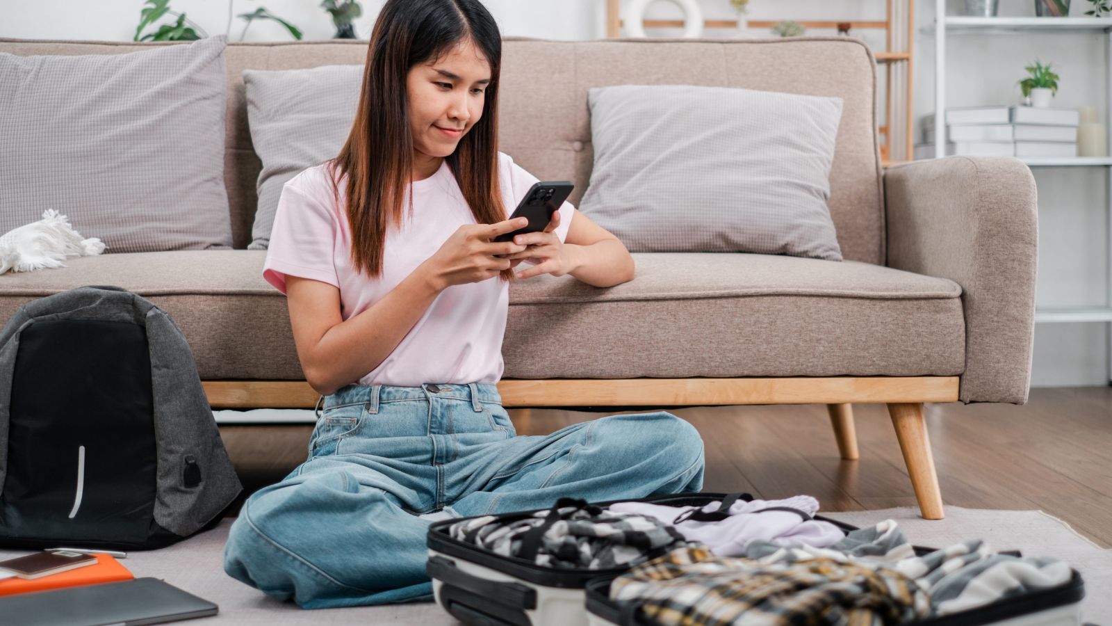 A photo of a traveler relaxing comfortably in simple well chosen hotel room peaceful atmosphere satisfied smart travel choice.