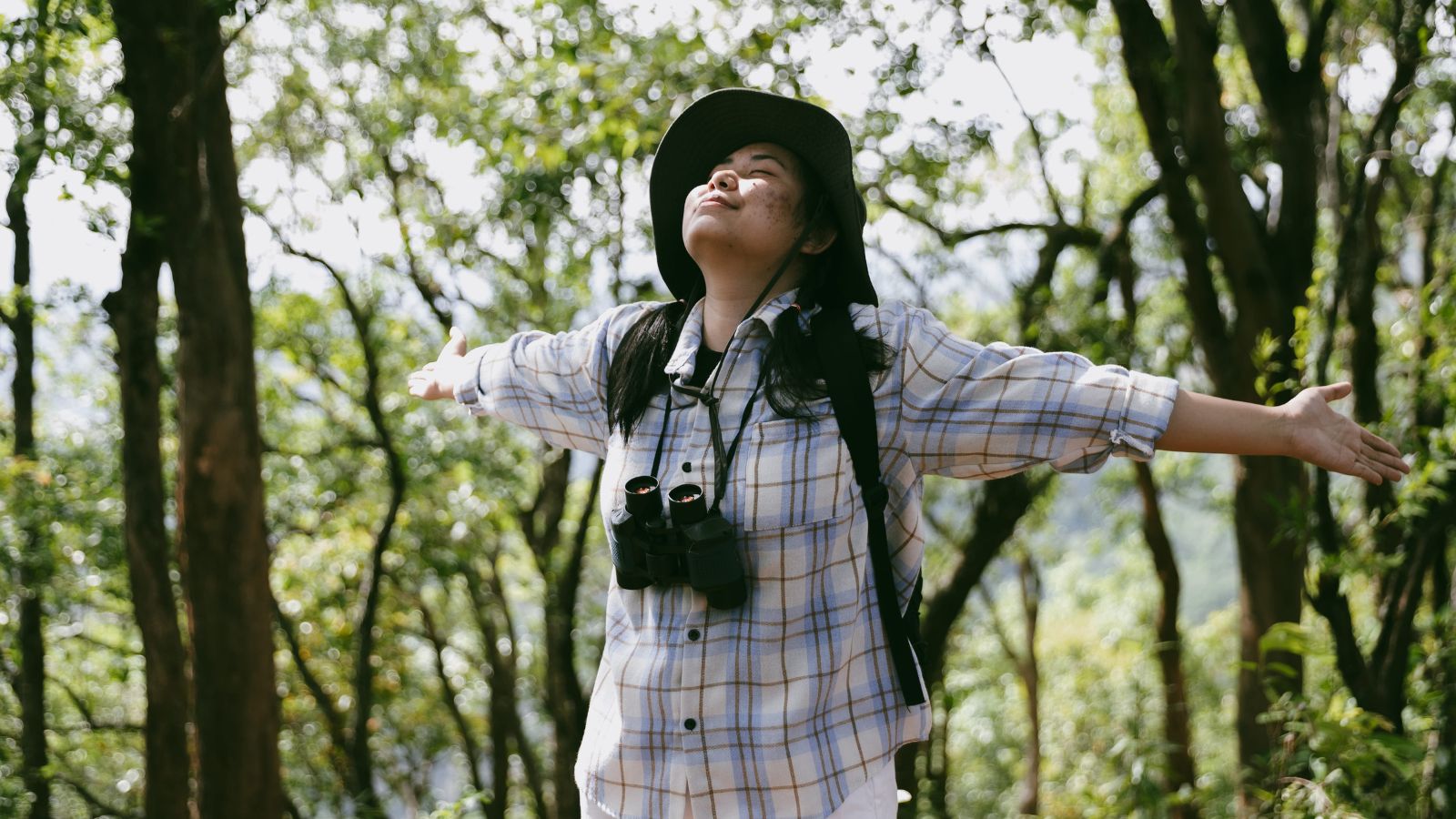 A photo of a traveler sitting calmly enjoying scenic surroundings relaxed unhurried travel moment peaceful atmosphere.