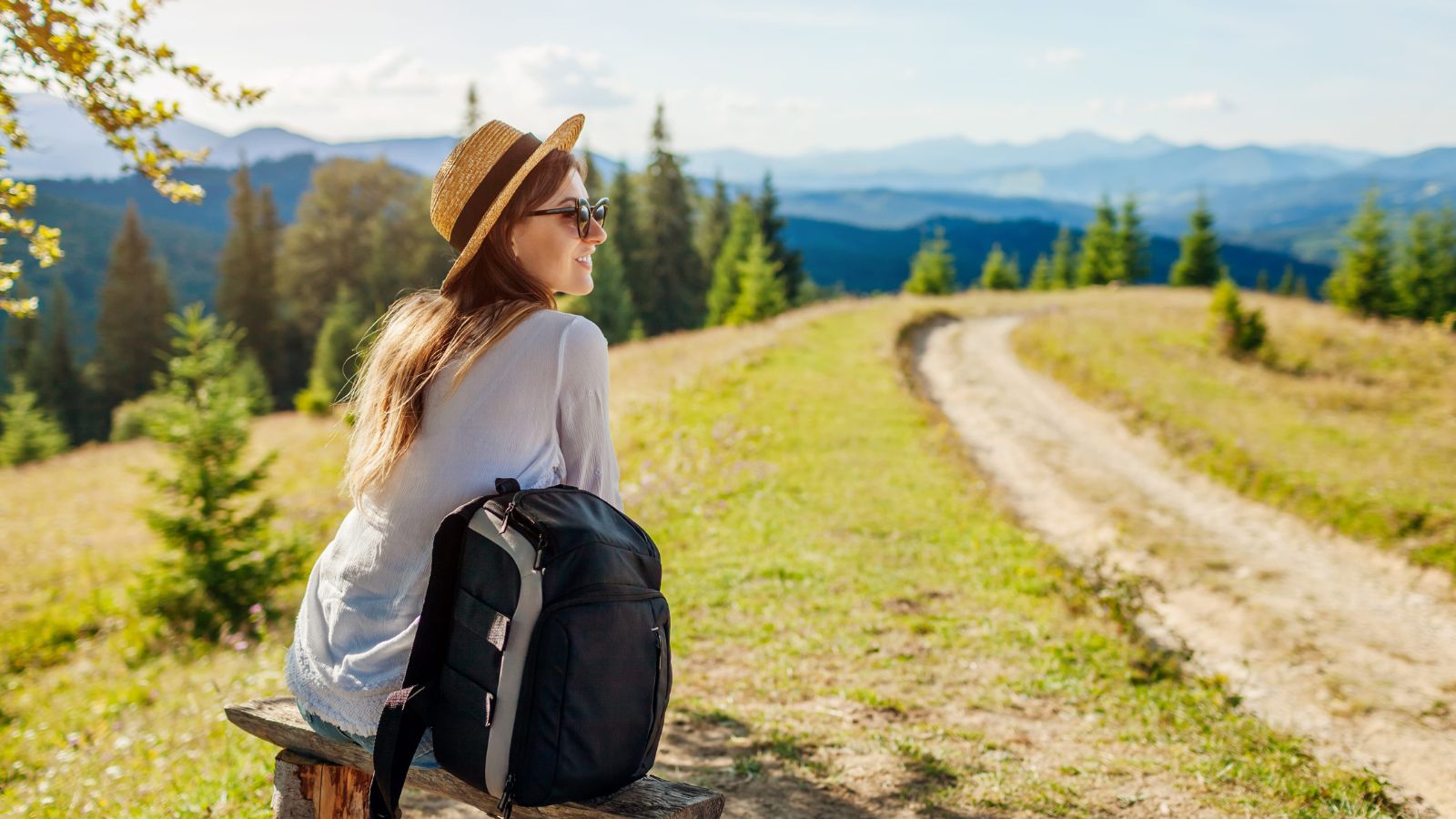 A photo of a raveler peacefully enjoying quiet scenic spot relaxed calm serene fully present slow travel experience.