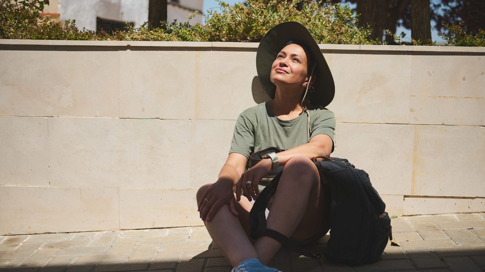 A photo of a traveler relaxing in one destination enjoying surroundings calm unhurried travel experience peaceful atmosphere.